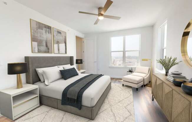 a bedroom with a large bed and a ceiling fan