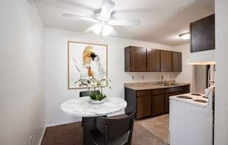 our apartments offer a kitchen and living room with a round table. Coon Rapids, MN Robinwood Apartment