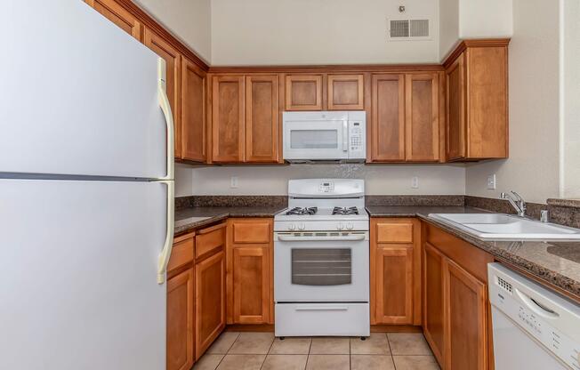 a kitchen with a stove top oven sitting inside of a refrigerator