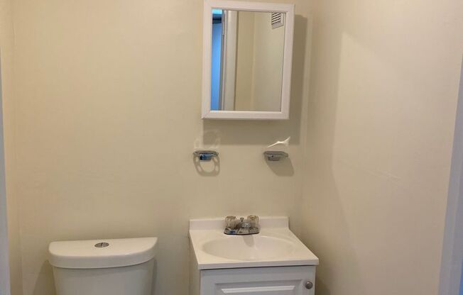 Finished Basement! Rear Parking Pad! Central Air! Available Now!