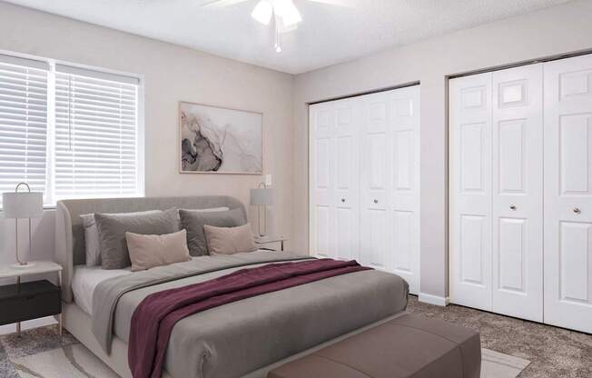 A bedroom with a large bed and a painting on the wall.