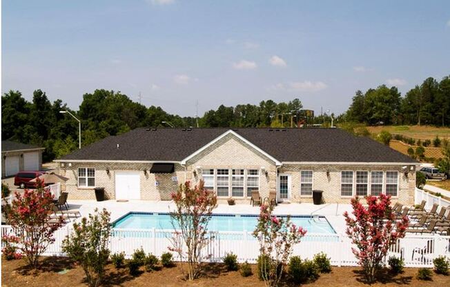 A house with a pool in the backyard.
