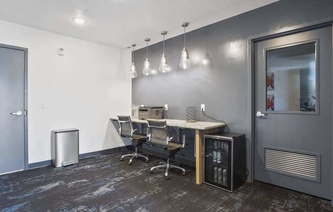 a small conference room with a desk and chairs at The Flats at Riverwoods, Provo, UT