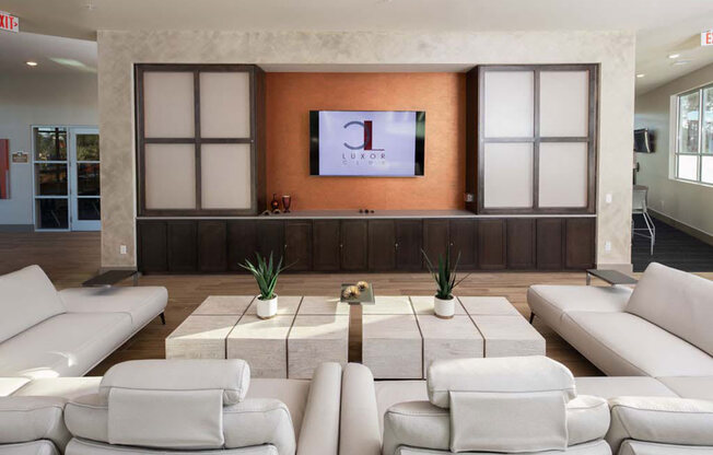 a living room filled with furniture and a flat screen tv at Luxor Club, Florida, 32258