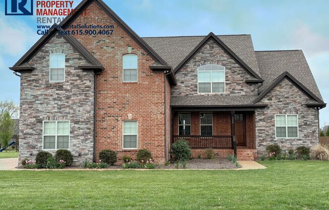 Gorgeous all brick 4 bedroom home in Mt. Juliet! Screened in Porch and 3 car attached garage!