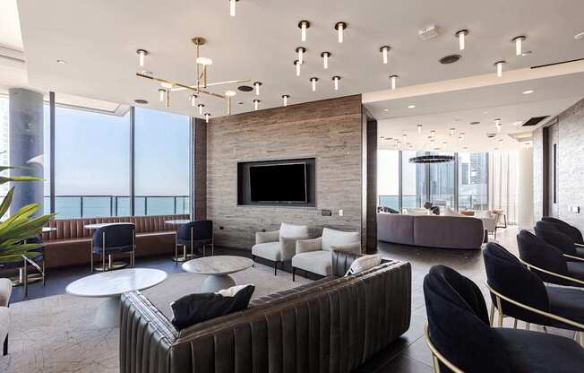 A modern living room with a fireplace and a large couch.