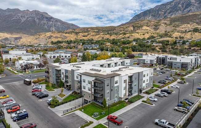 an aerial view of an apartment complex with mountains in the background