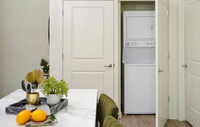 a kitchen and dining room with white appliances and a table