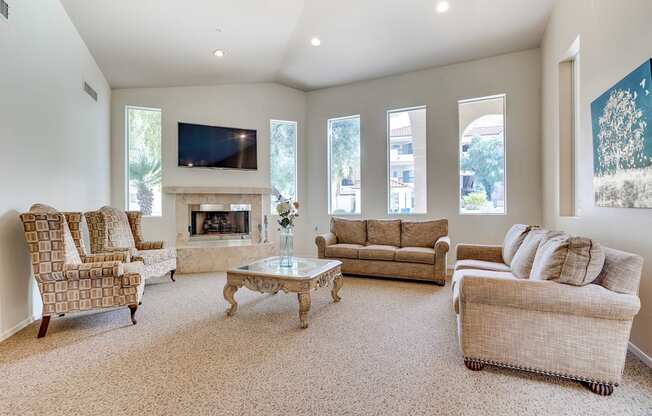 A living room with a fireplace and a television.