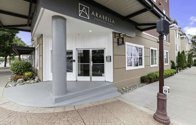 View of the property entrance with Property Signage at Arabella Apartment Homes, Shoreline, WA