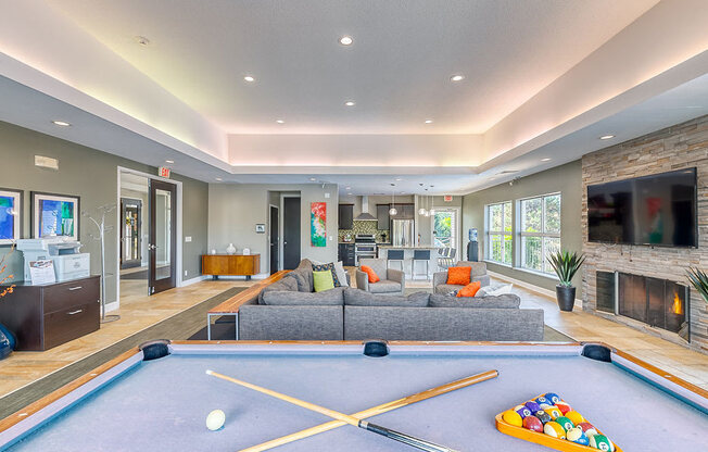 Expansive clubhouse with billiards table at Waterchase Apartments in Wyoming, MI