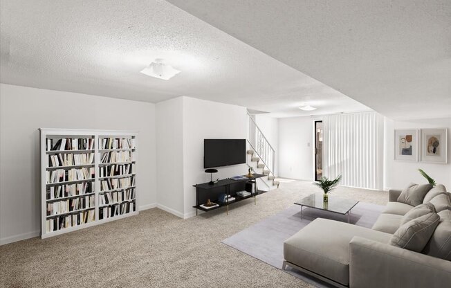 a living room with a couch and a tv