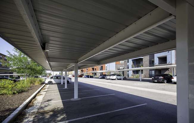 awning over a parking lot in front of a building