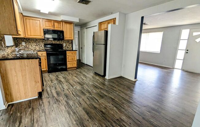 Beautiful 2/1/1 1200 Sq. Ft. with custom kitchen, large living room & family room & an enclosed lanai!!