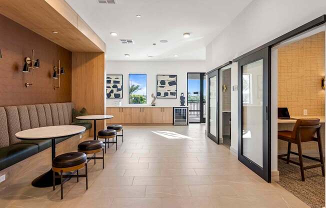 A modern interior with a long table and chairs.