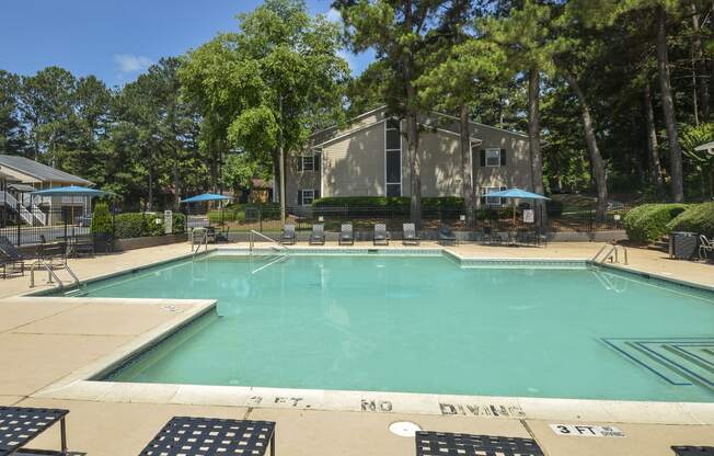 Daytime view pool with patio and sundeck at Harvard Place Apartment Homes by ICER, Lithonia, 30058