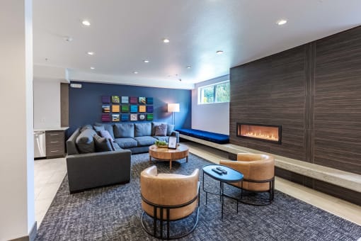 a living room with couches and chairs and a fireplace