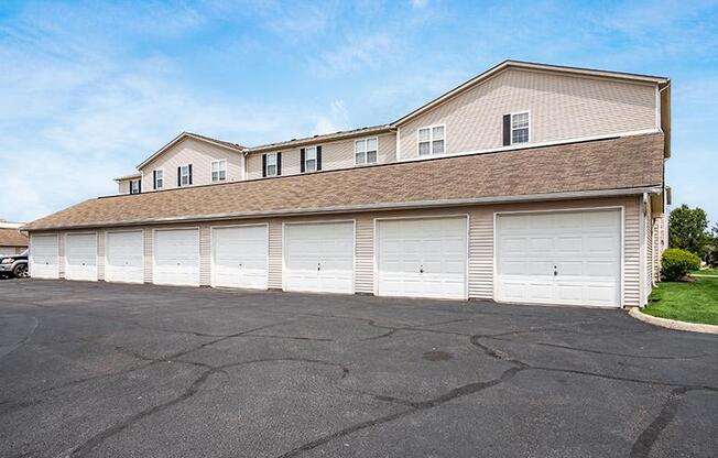 A large building with a garage door is in the foreground.