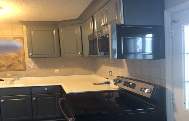 Kitchen With Black Appliances at Timberstone, Charlotte