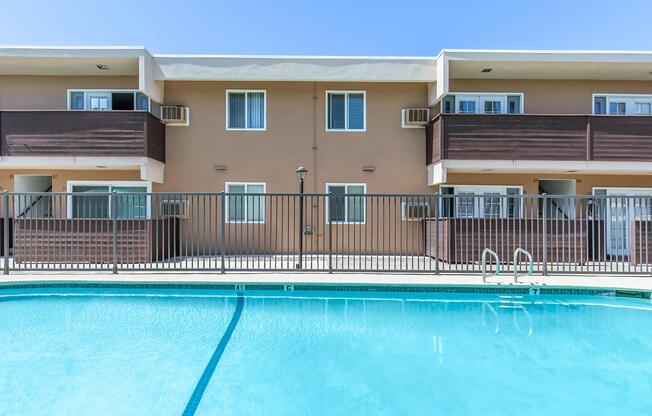 a large pool of water in front of a house