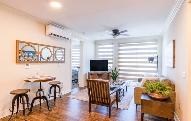 a living room with a couch and a table and a tv