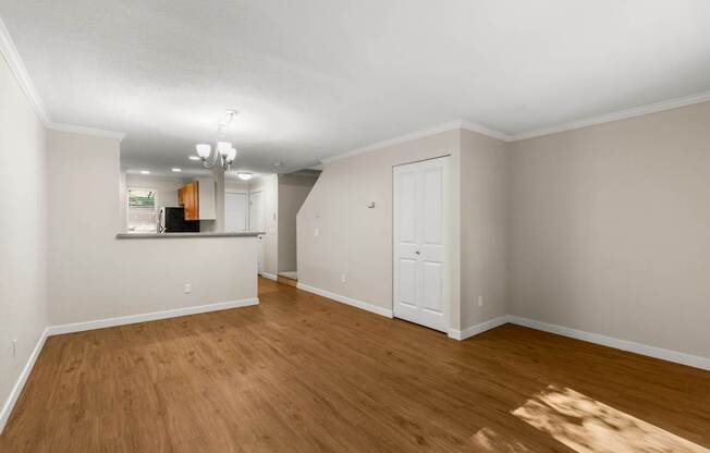 A room with wooden floors and white walls.