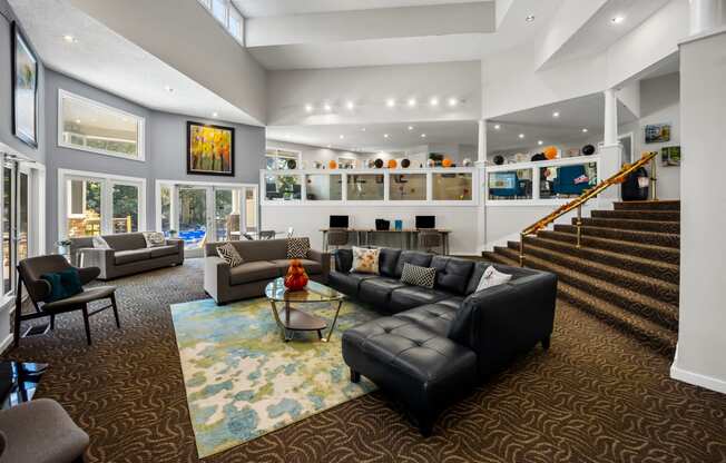 Clubhouse living room with leather furniture  at University Ridge Apartments, Durham, NC, 27707