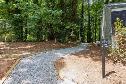 a path leading to a campsite in a wooded area  at Lake Johnson Mews, Raleigh, 27606