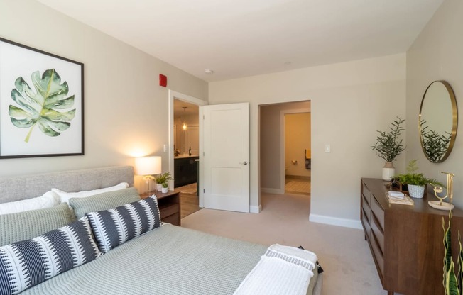 a bedroom with a bed and a dresser at Edgebrook Residences, New Hampshire, 03054