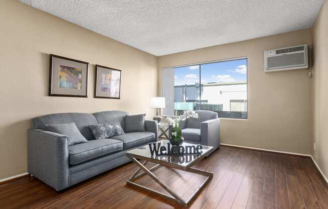 Pet-Friendly Luxury Apartments in Sherman Oaks, CA - Parkview Terrace Living Room with Wood Style Floors and Plenty of Natural Lighting