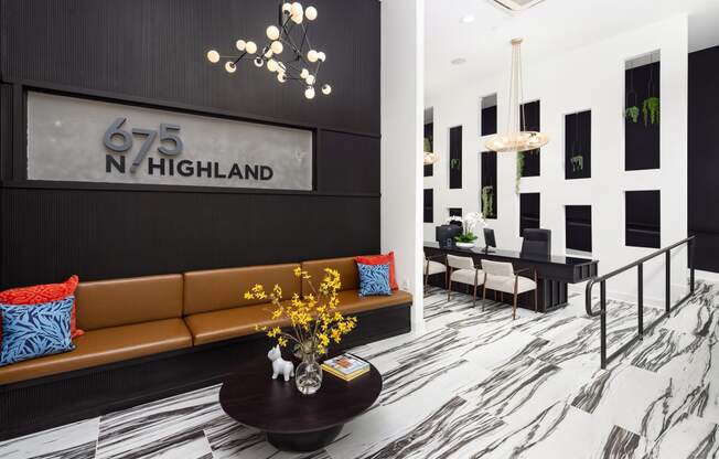 the lobby of 625 north highland with a couch and a table