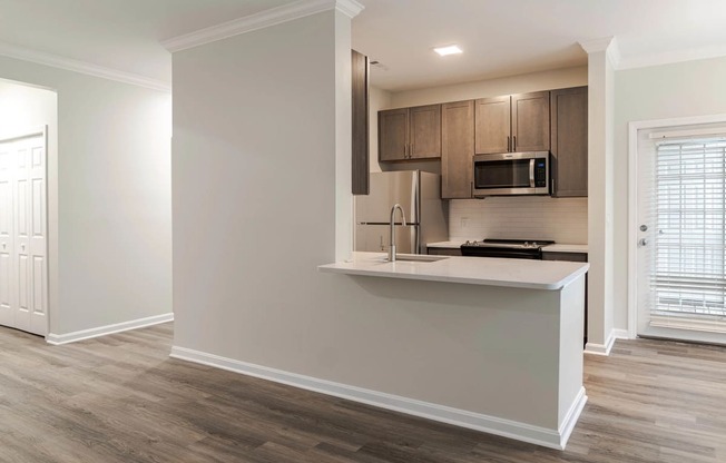 a kitchen with a counter top and a microwave