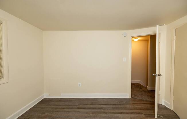 A room with a doorway leading to another room.