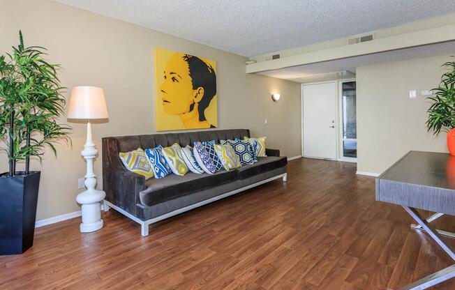 a living room filled with furniture and a flat screen tv