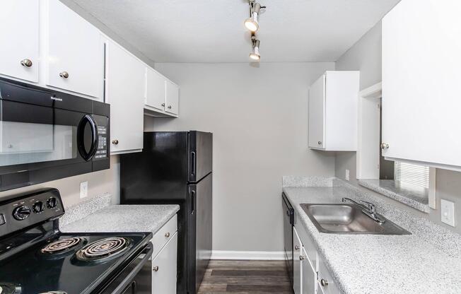 a kitchen with a stove and a sink