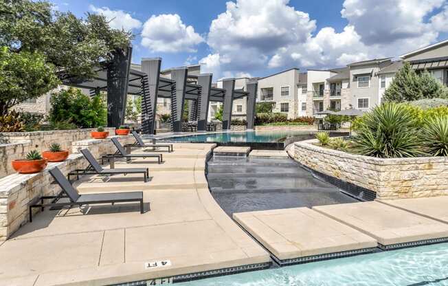 poolside sun deck lounging area at The Allure apartments