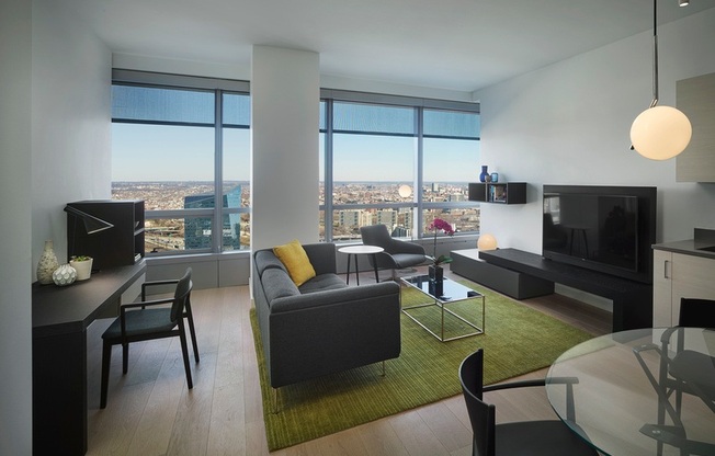 A modern living room with a view of the city.