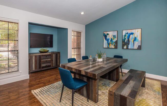 a living room filled with furniture and a large window