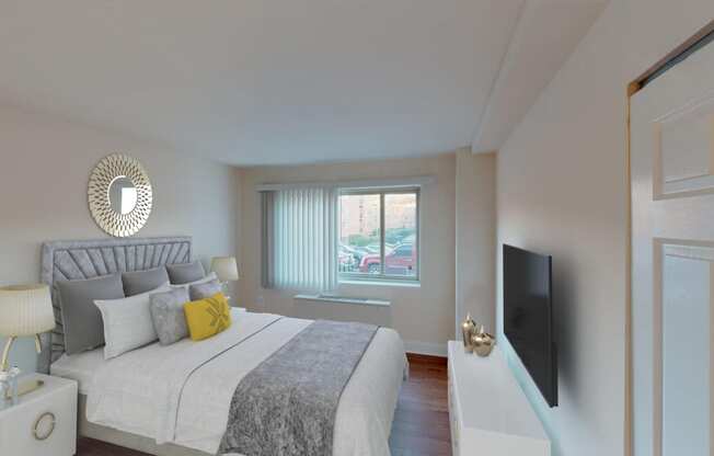 a bedroom with a bed and a window at penn view apartments in washington dc