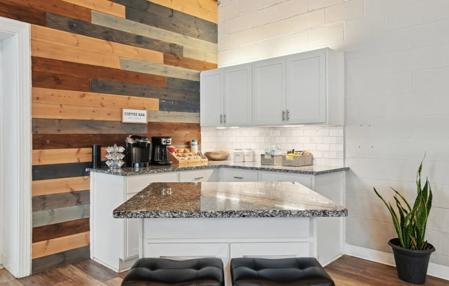 Kitchen with white cabinets and a marble counter top  at Emerald Bay, Charlotte, 28217