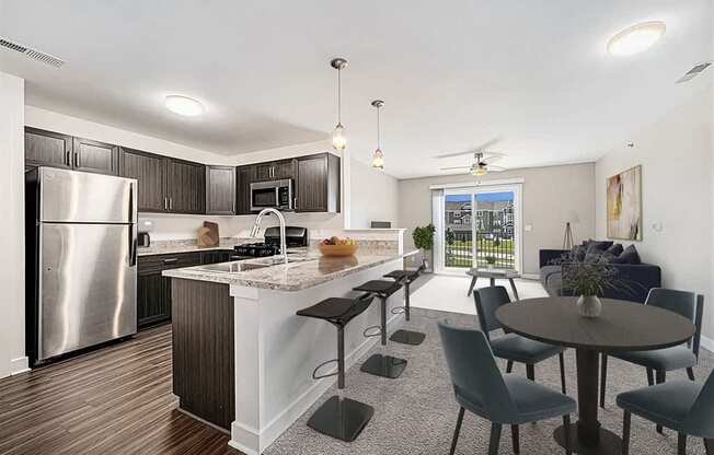 an open kitchen and living room with a stainless steel appliances at Trade Winds Apartment Homes, Elkhorn, Nebraska