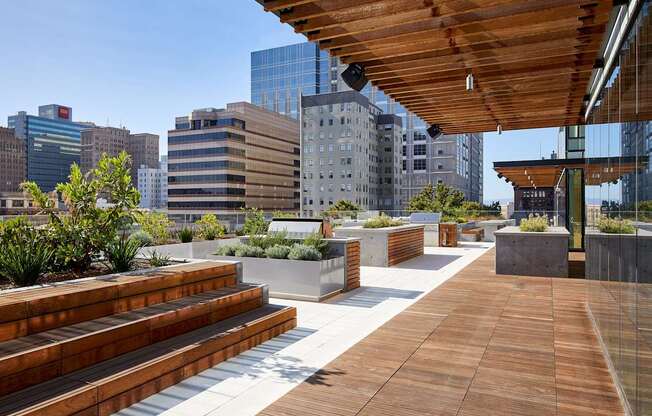A wooden deck with steps and a metal railing.
