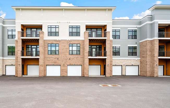 A large building with a parking lot in front of it.