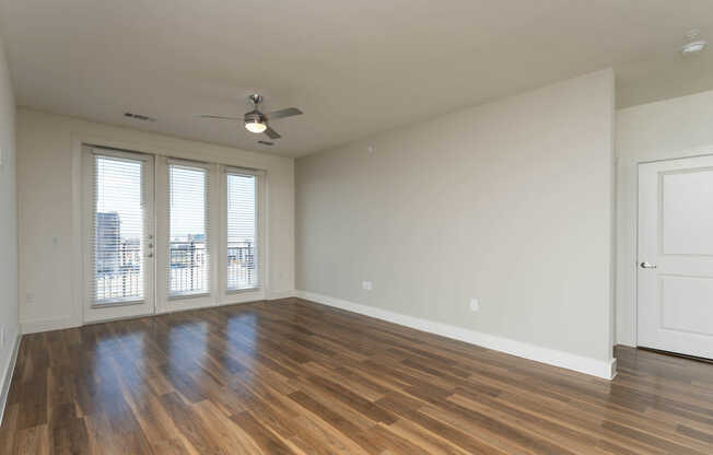 Living Room with Balcony and Hard Surface Flooring