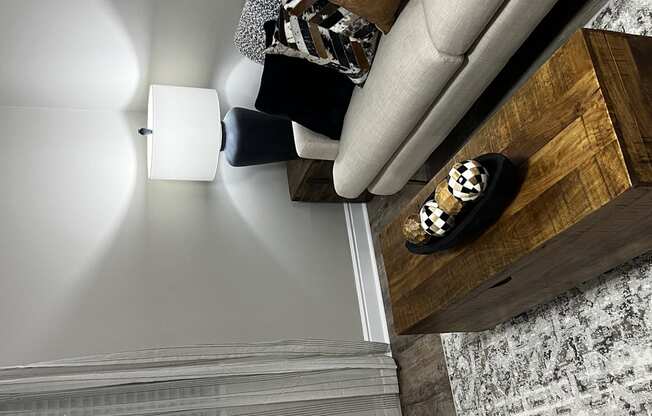 a view from above of a living room with a couch and a coffee table