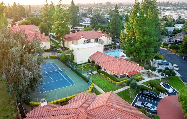 Aerial view of tennis court, parking and leasing office at Woodbend, California