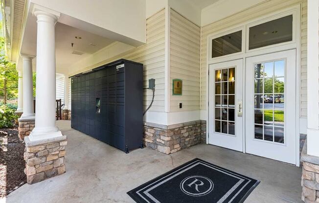 the front porch of a home with a rug on the floor