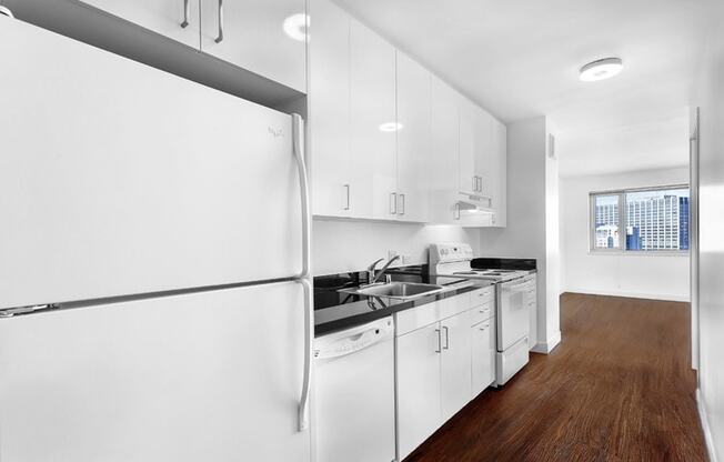 a kitchen with a white refrigerator freezer next to a stove top oven