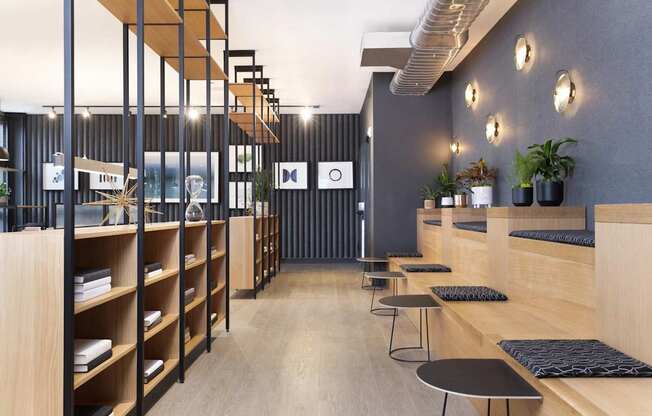 A modern interior with wooden shelves and black and white decor.