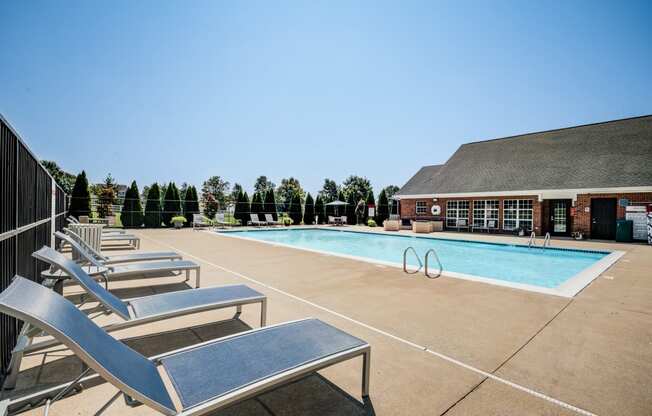 our resort style swimming pool is in front of our building with lounge chairs